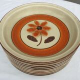 Set 11 plates 1970 Revernay Sarreguemines orange and brown on sandstone background