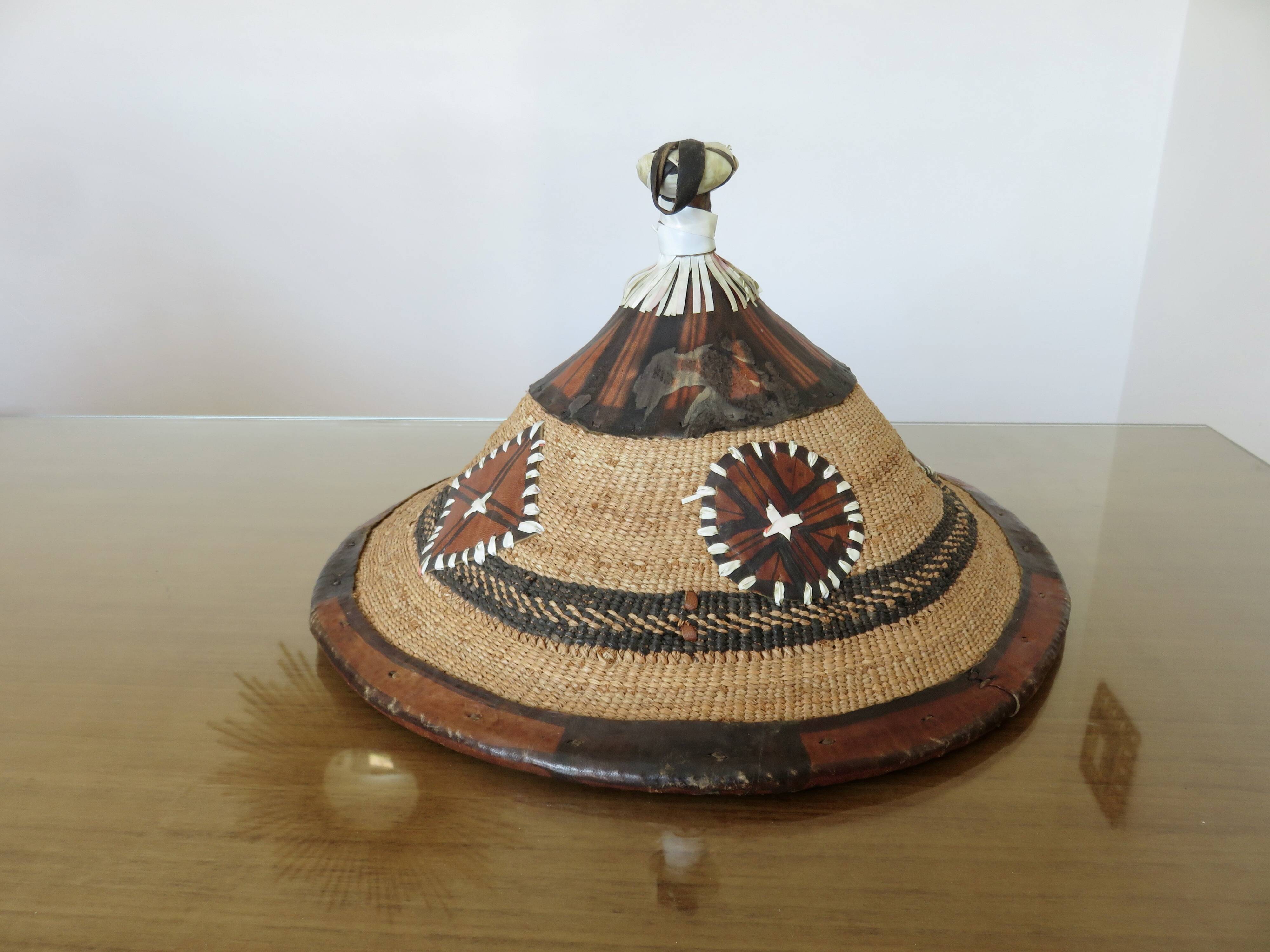 African conical hat, Fulani, in leather and braided rope, 1900, wall decoration