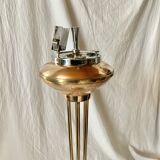 Old brass and chrome-plated metal ashtray on stand