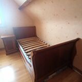 Bed with cherry wood base and bedside table