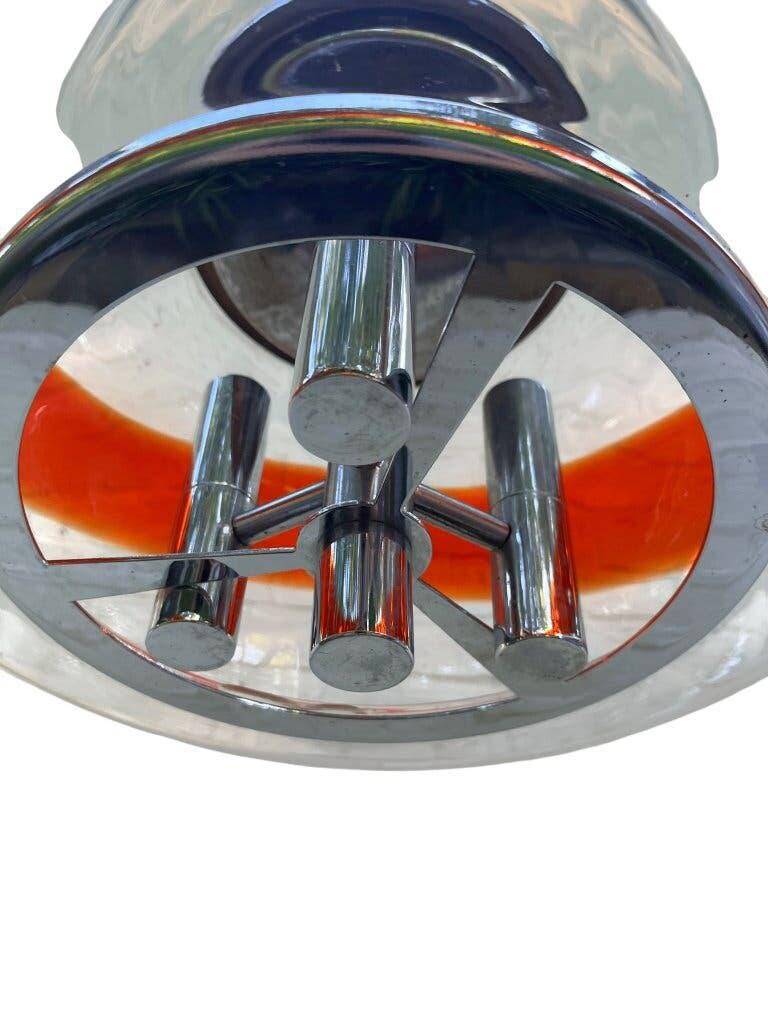 Vintage Murano glass pendant light with orange accent.