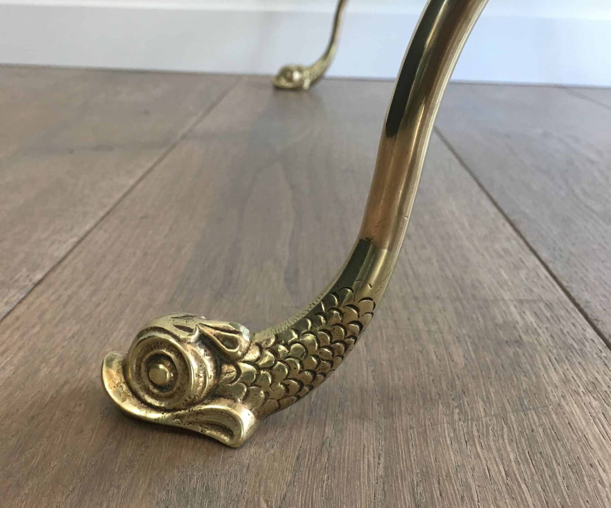 Neoclassical brass style coffee table with dolphin head decoration