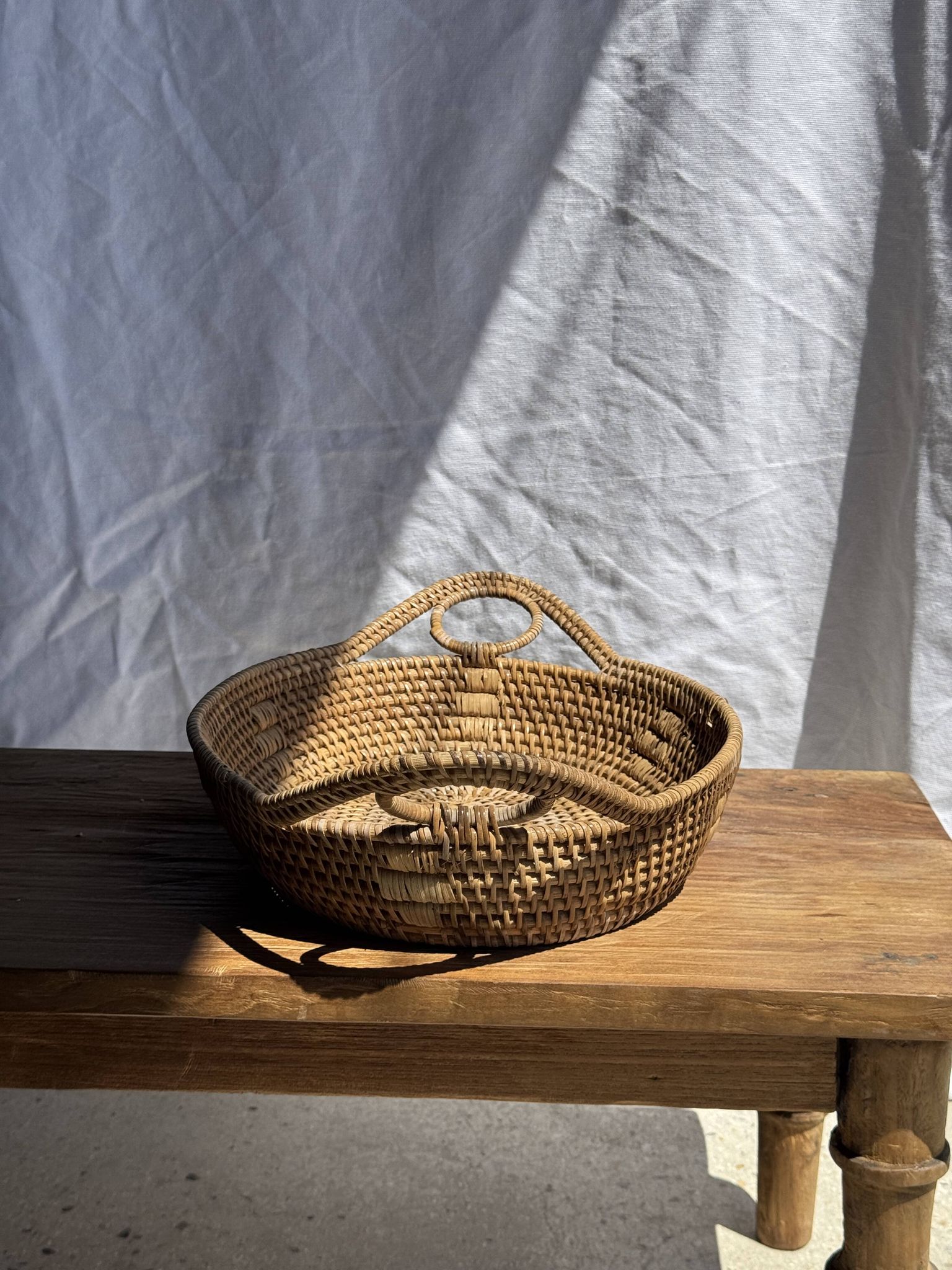 Large flat oval woven rattan basket with handles, Indonesian L53x64