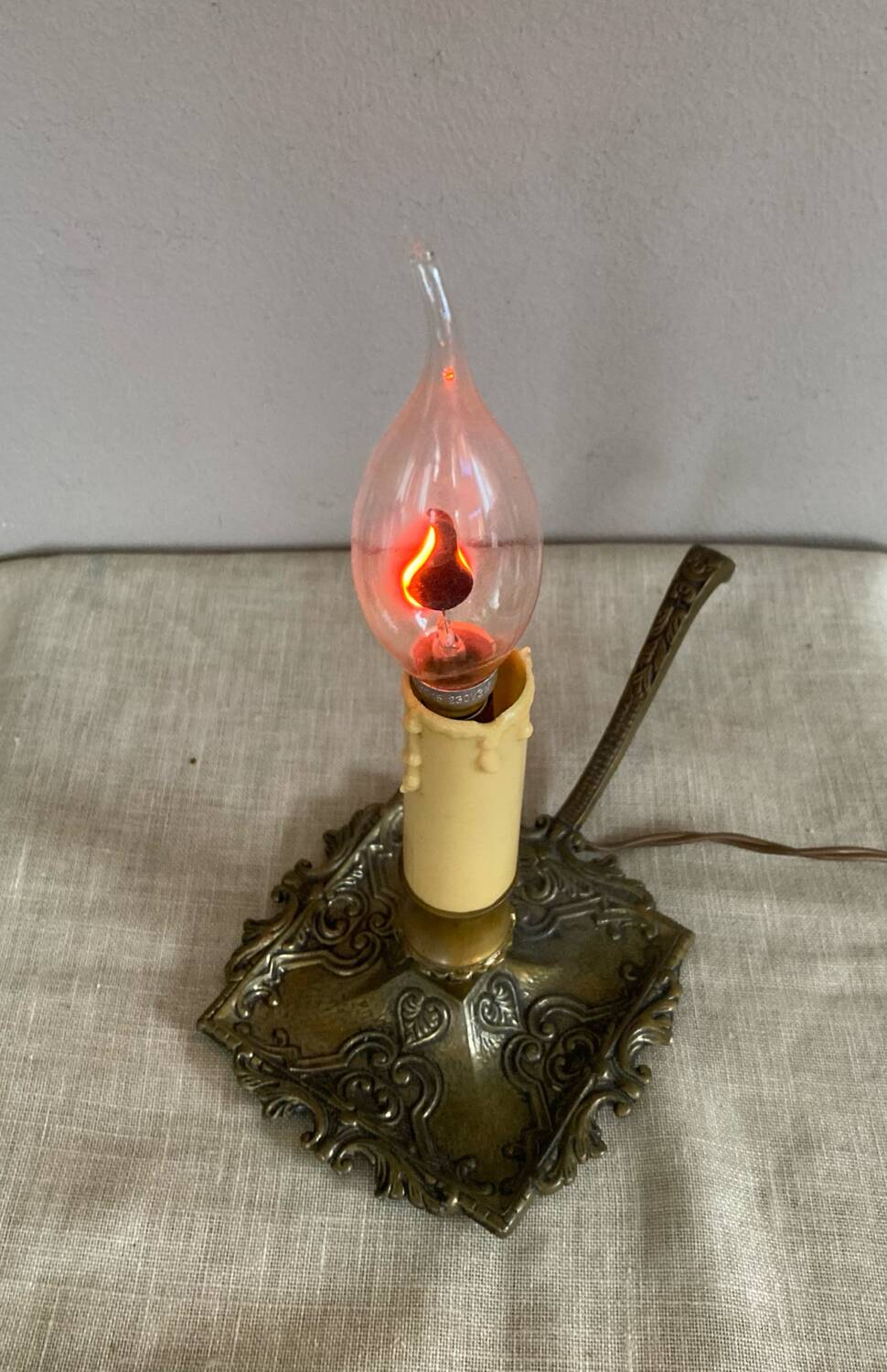 Candle holder with 20th century spelter socket mounted as a flame bulb lamp