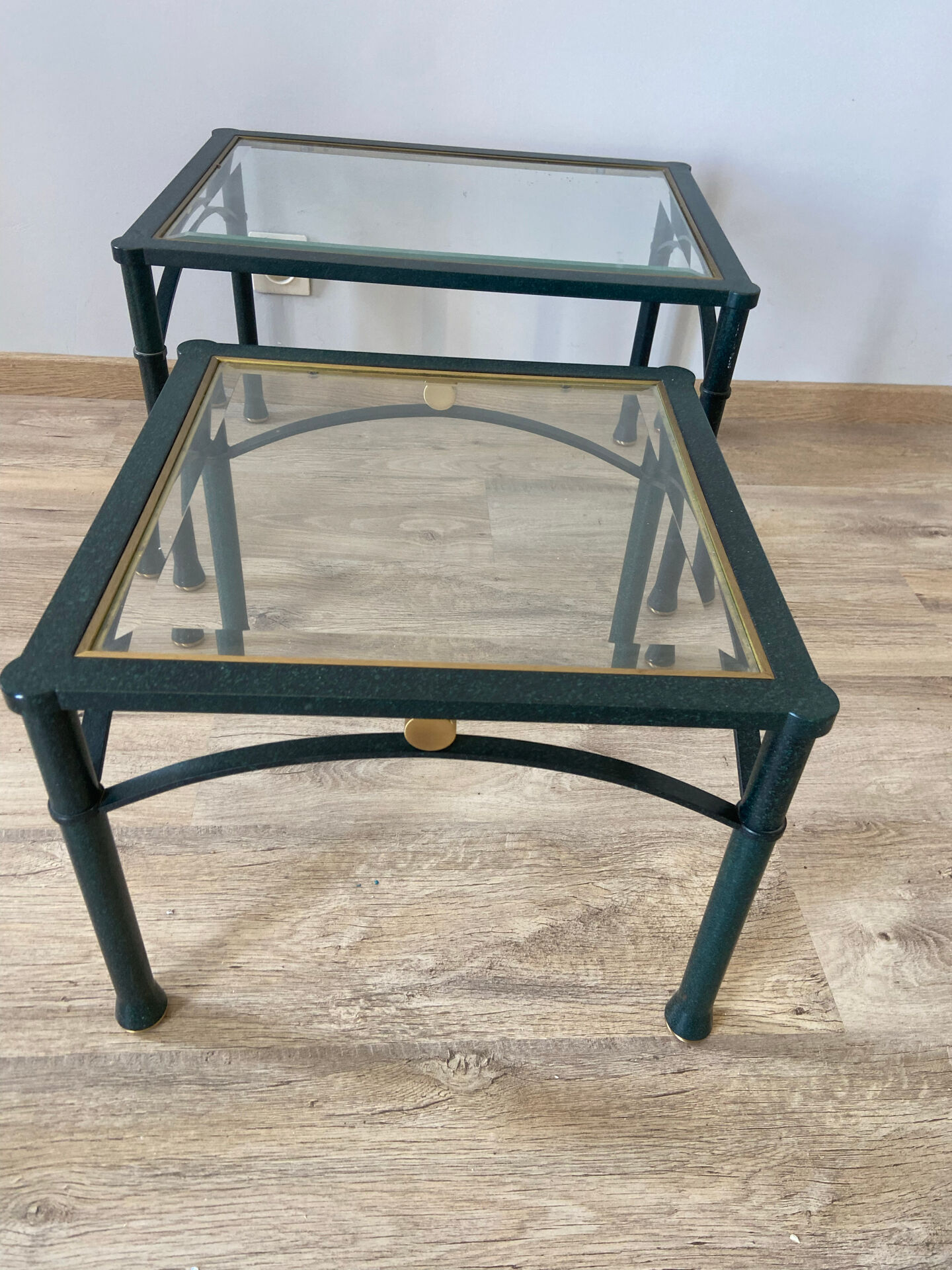 2 nesting tables from the 1960s in metal and bevelled glass.