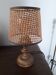 A very original vintage lamp with its cane lampshade