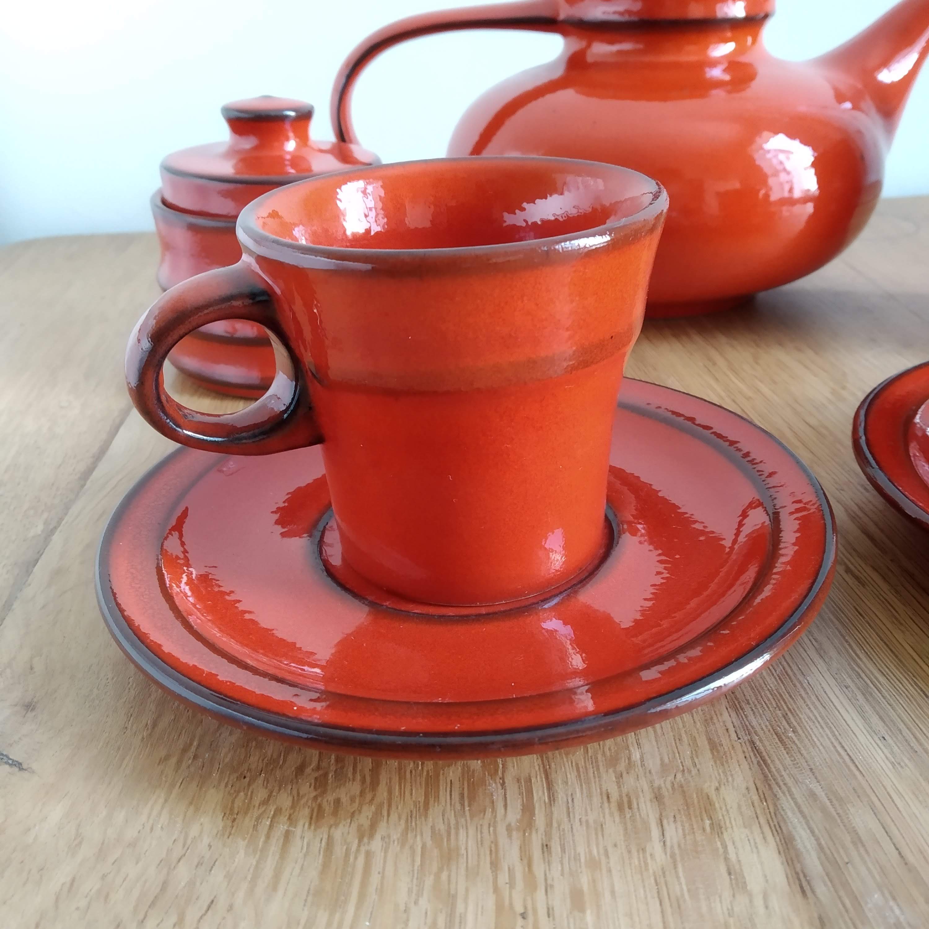 Red ceramic tea service