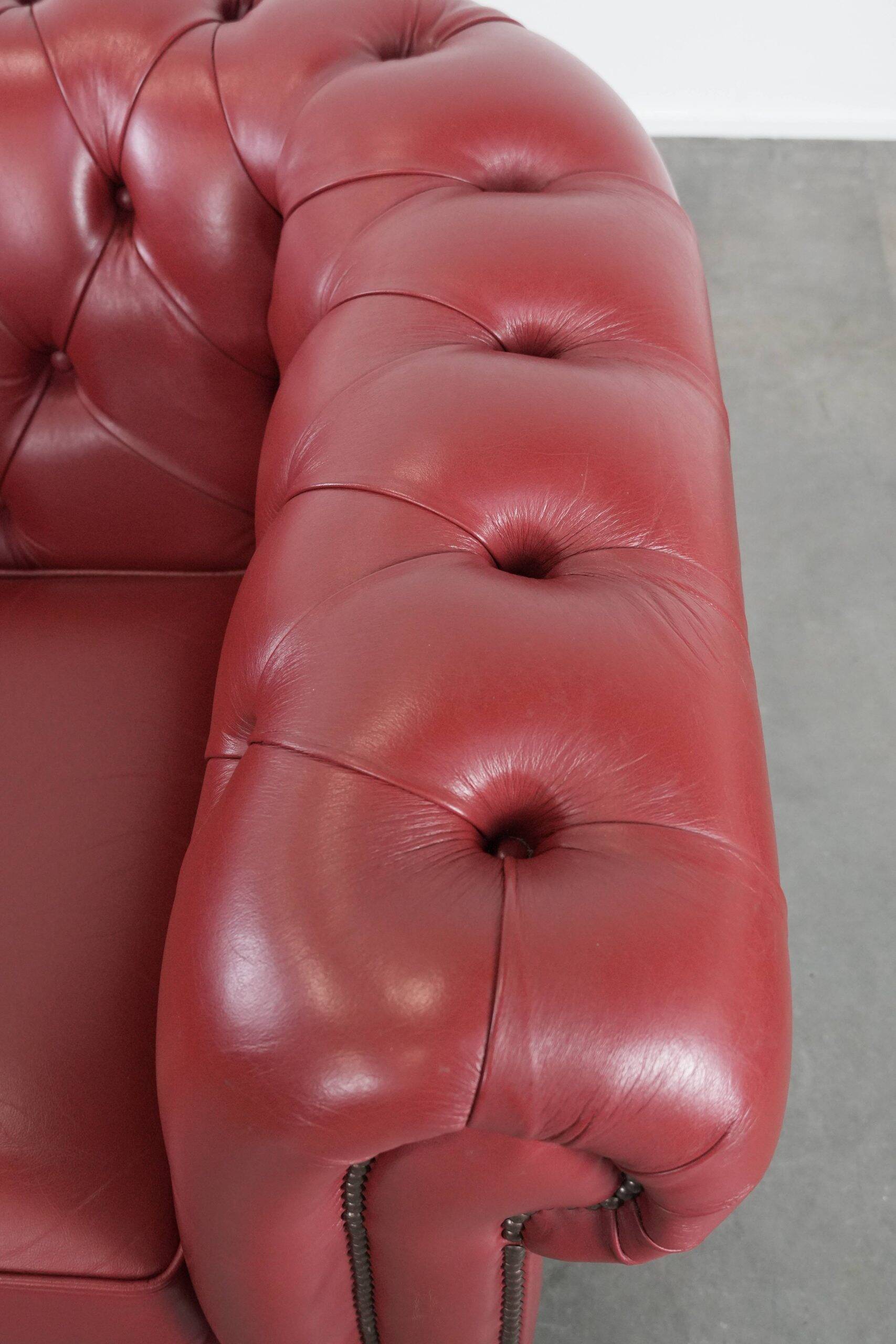Amazing English cowhide Chesterfield armchair in a stunning red colour