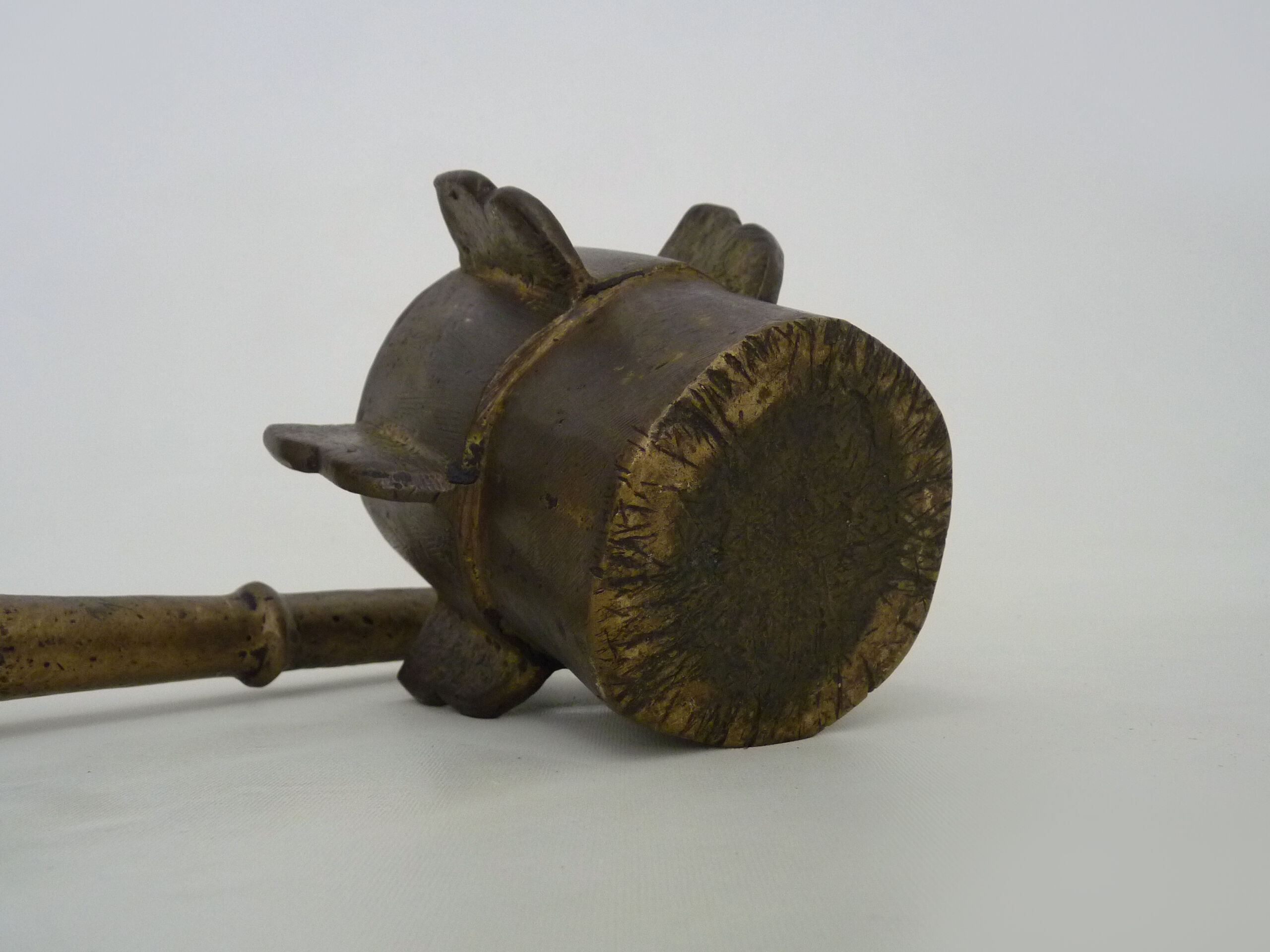 Old apothecary mortar with fins and its bronze pestle