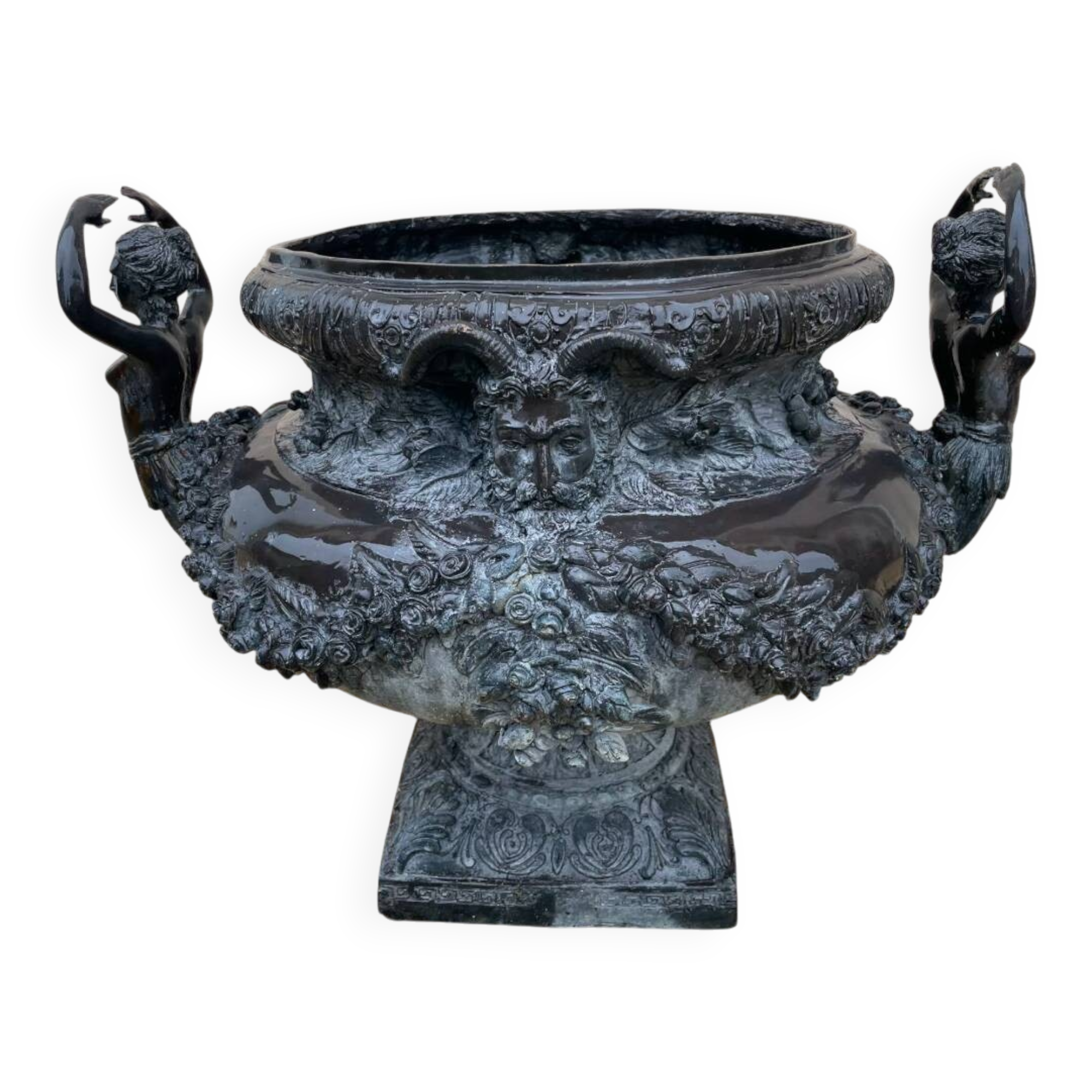 Cast iron vase decorated with mermaids.