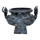 Cast iron vase decorated with mermaids.