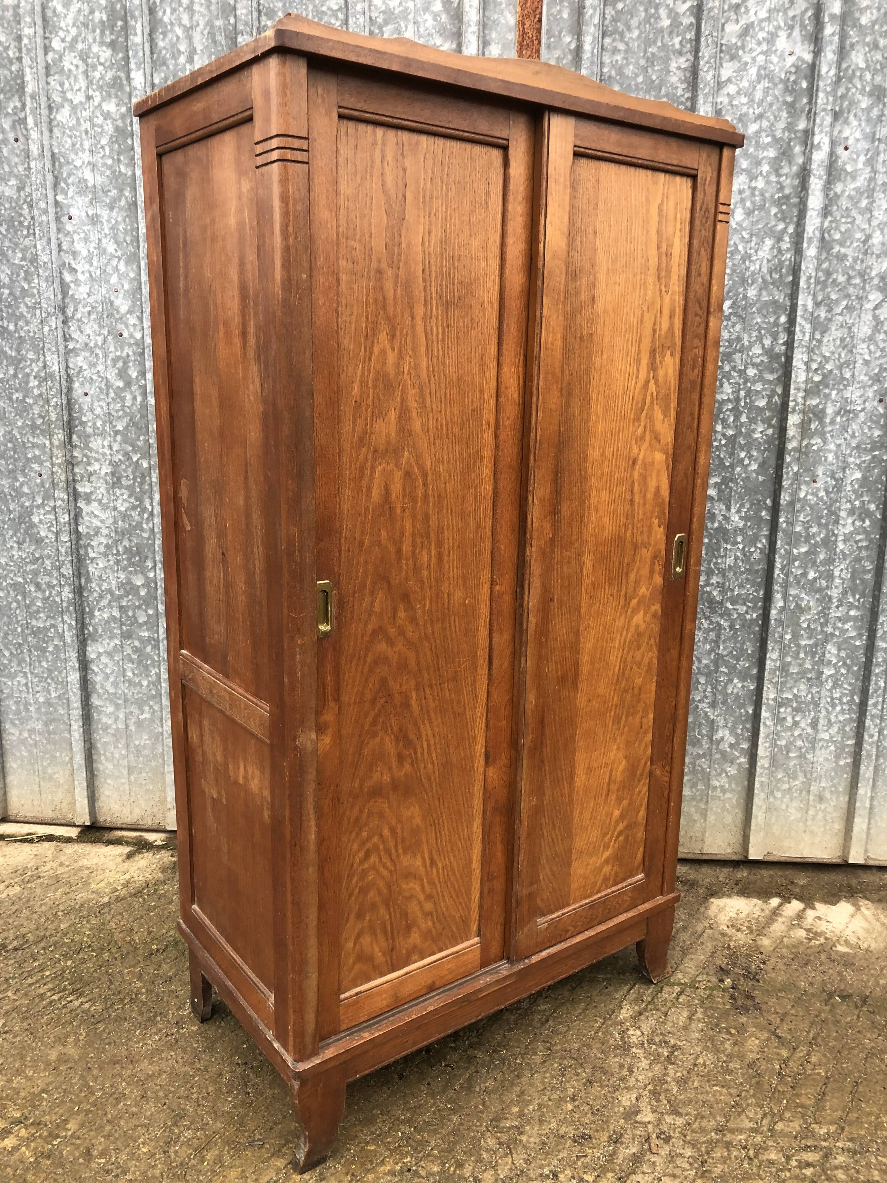 Vintage reconstruction period oak wardrobe with 2 sliding doors.