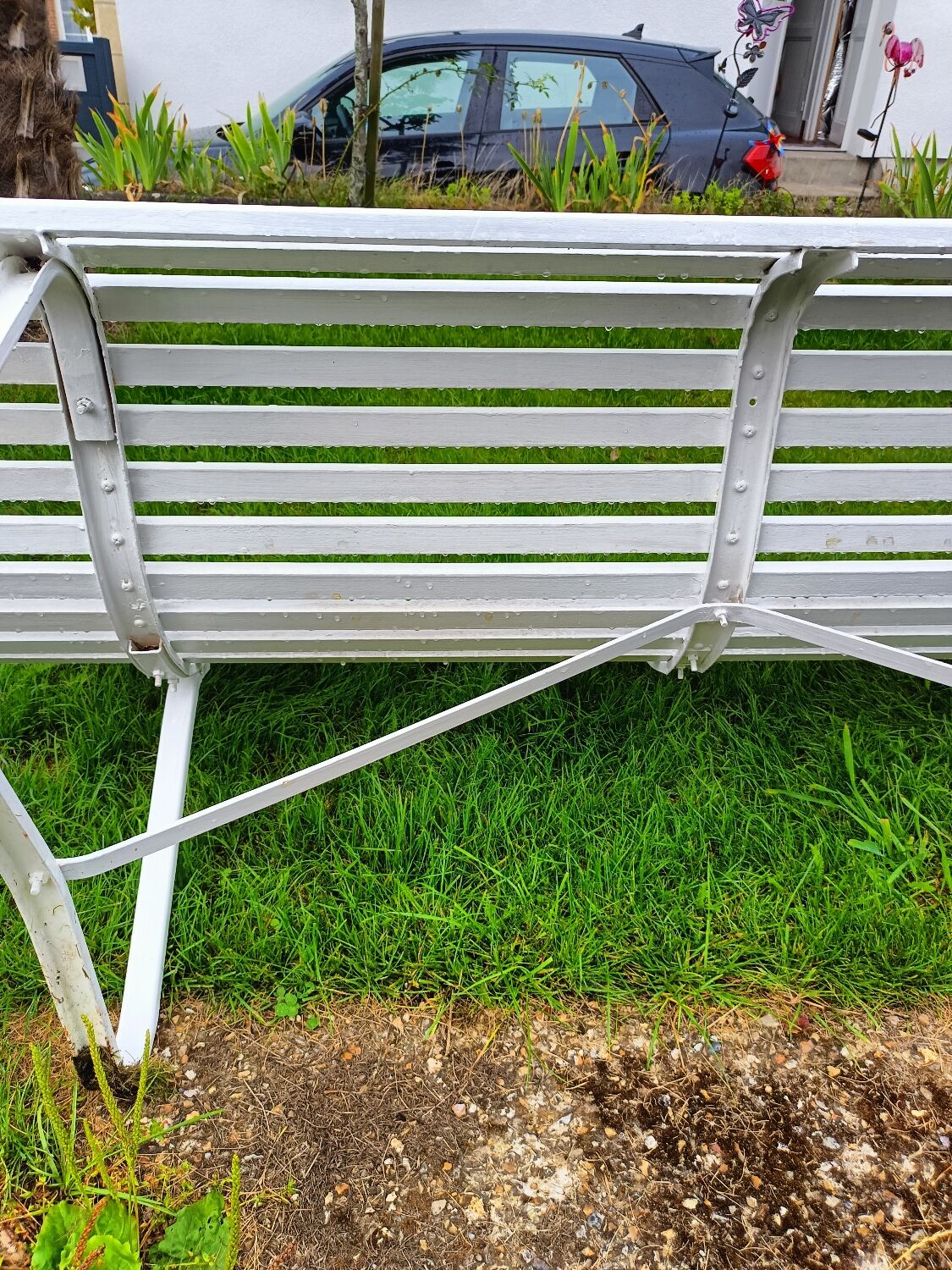 Antique garden bench with metal legs