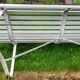 Antique garden bench with metal legs