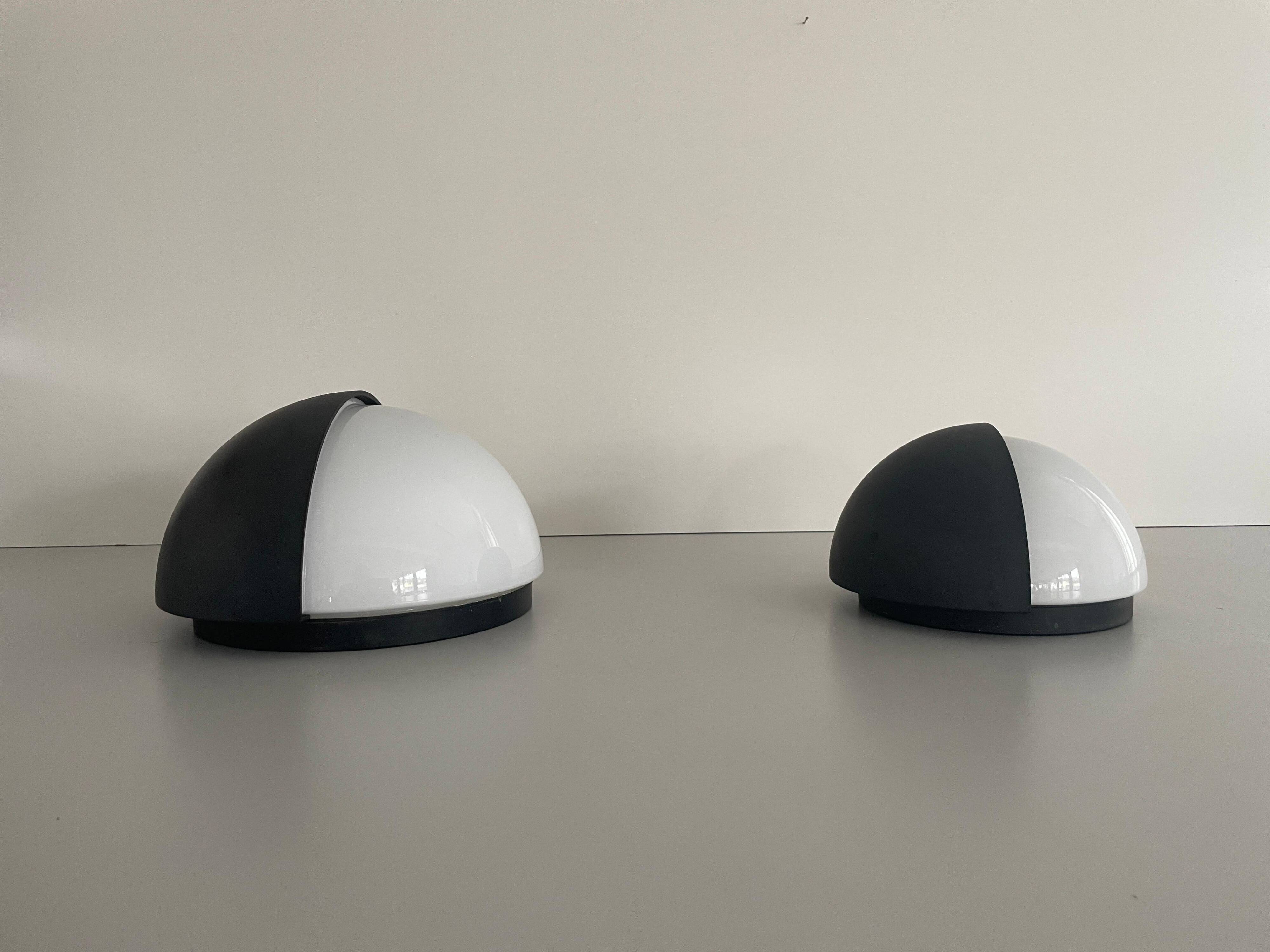 Round black metal wall lights, small and large set, by Bega, 1970s, Germany.