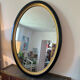 Miroir vintage ovale bois noir et doré