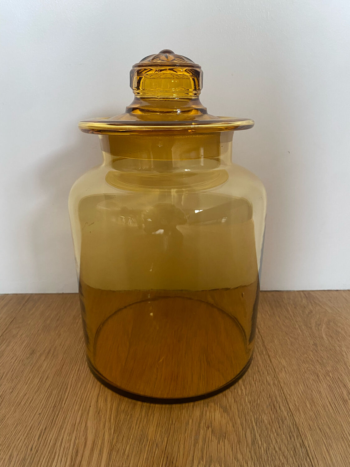 Old apothecary jar in blown amber glass