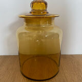 Old apothecary jar in blown amber glass