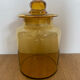 Old apothecary jar in blown amber glass