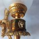 Wall lamp in gilded bronze with a lion's head and engraved globe.