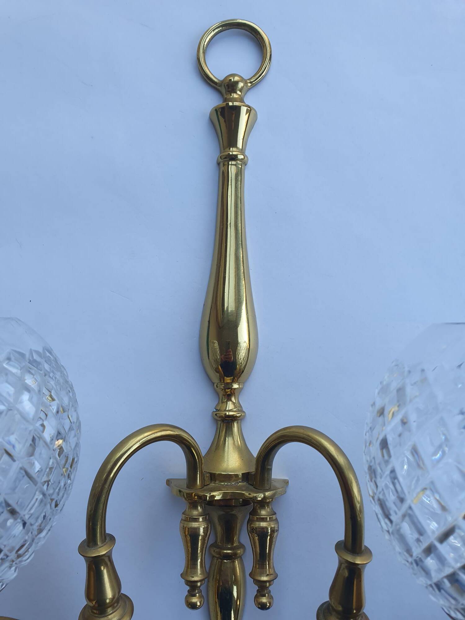 Two-light wall light gold with antique crystal globes