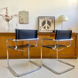 Pair of vintage chrome and black faux leather armchairs