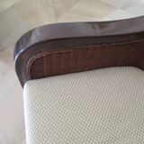 Vintage colonial-style armchair in woven rattan and exotic wood