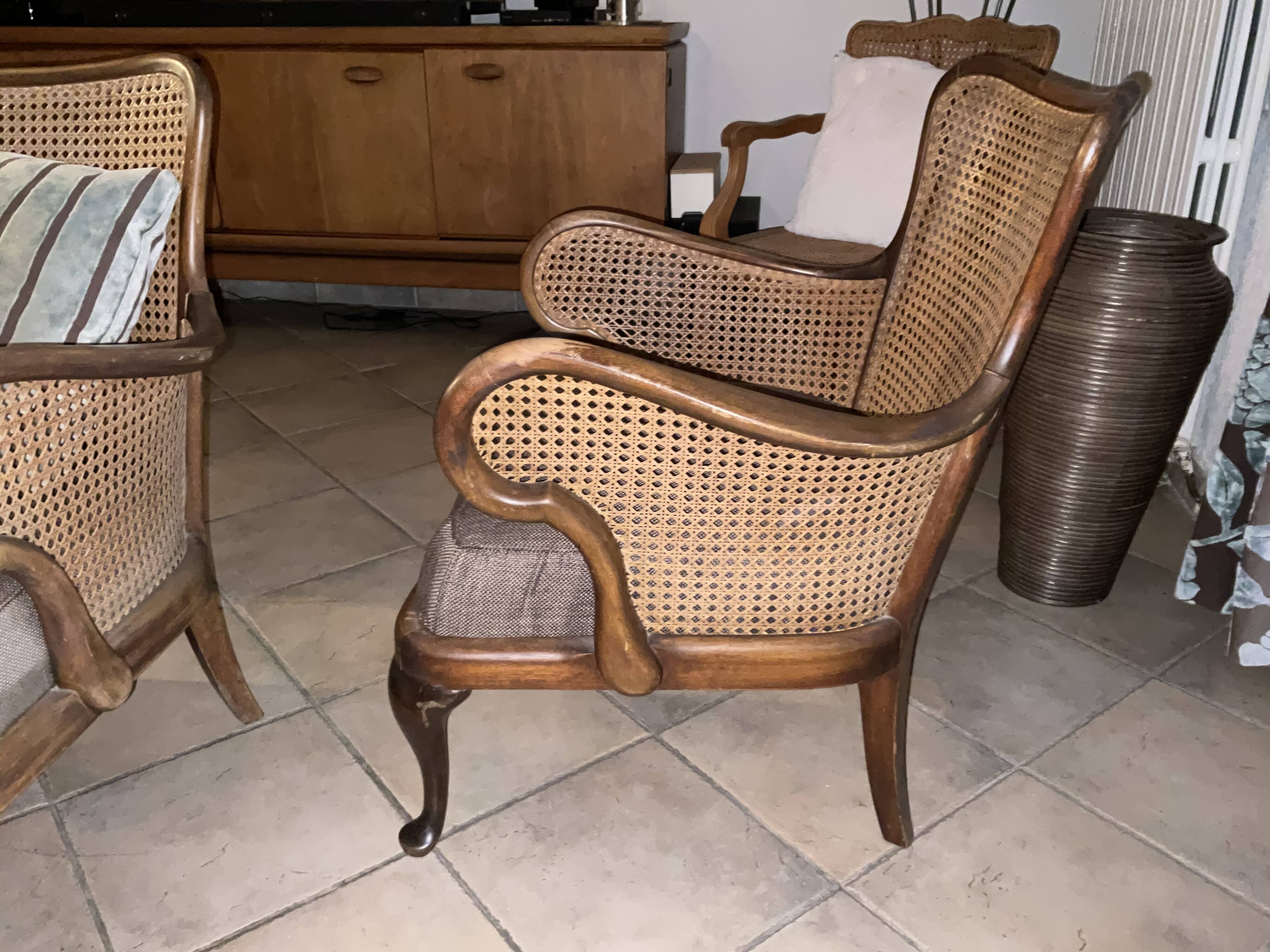 Chair with cane back and recently reupholstered fabric seat.