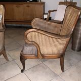 Chair with cane back and recently reupholstered fabric seat.