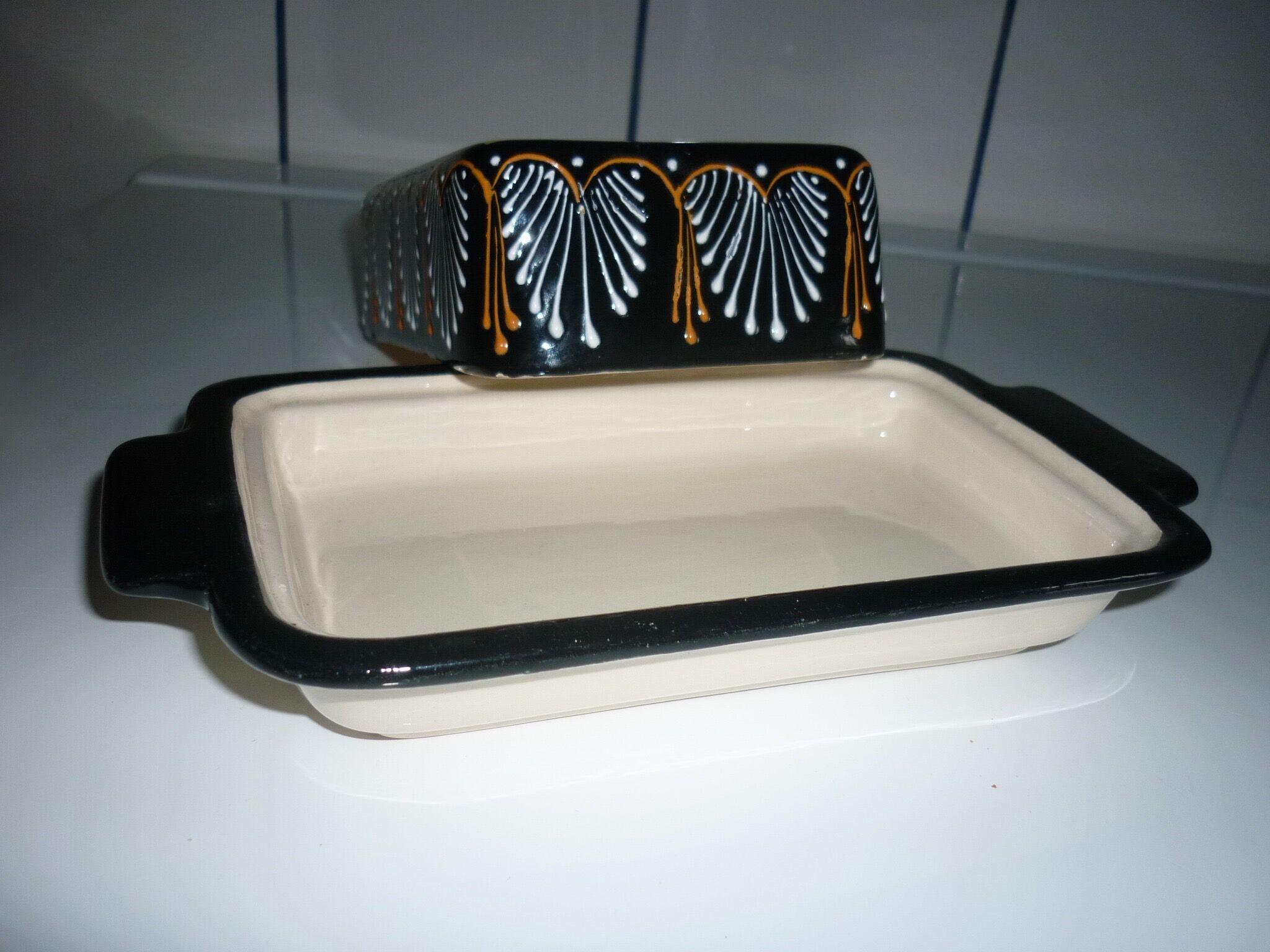 Butter dish with its black lid signed HB