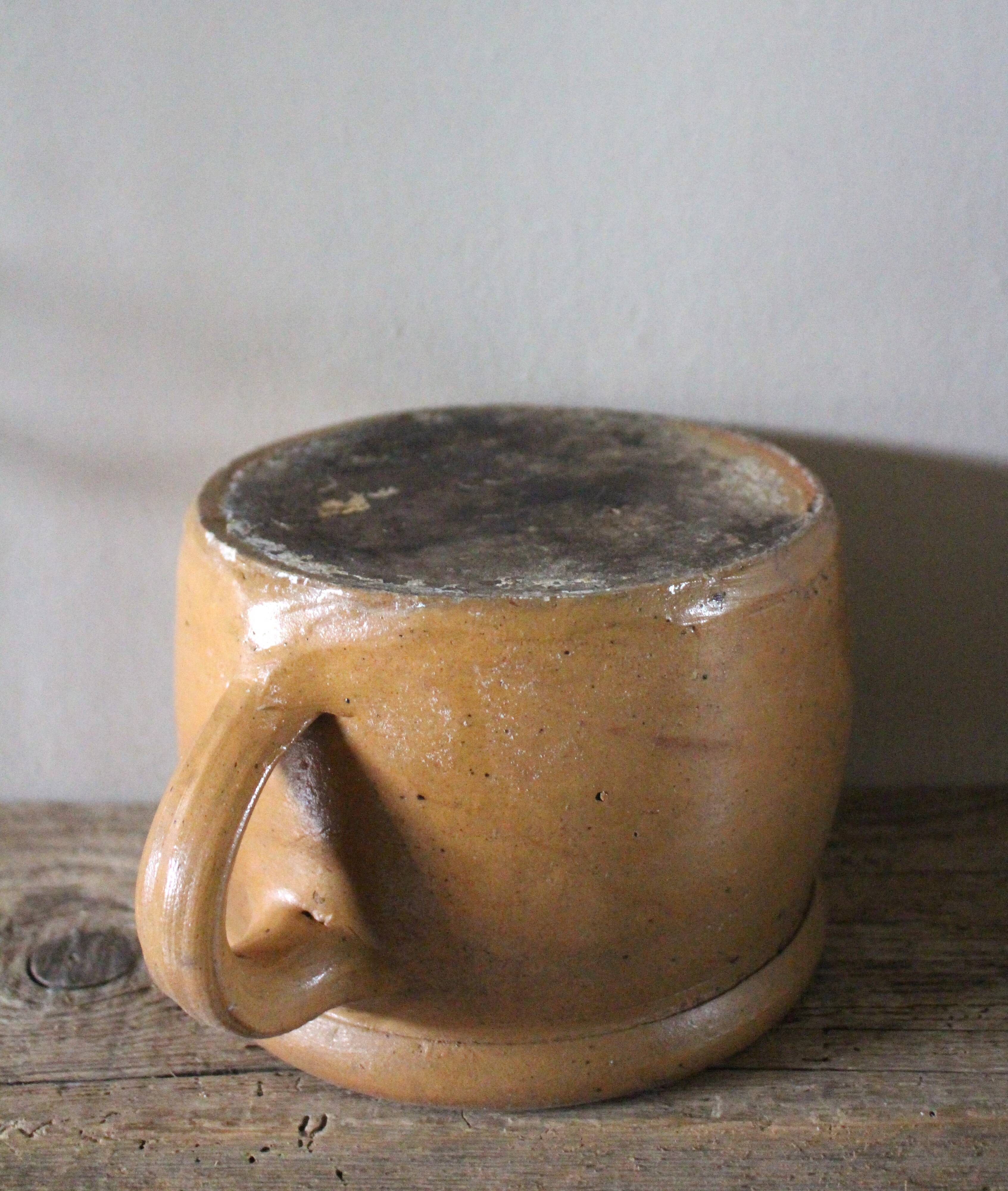 Round terracotta milk jug with handle