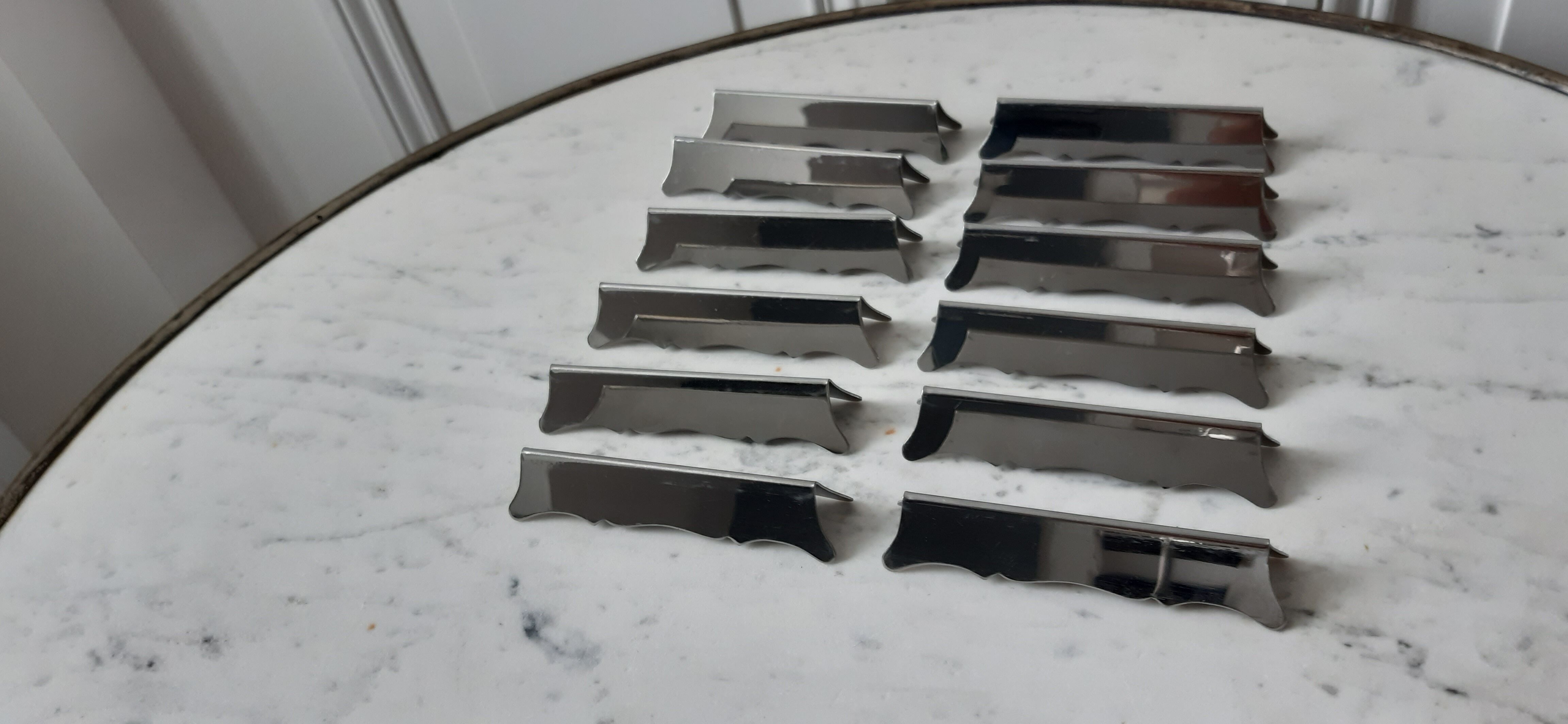 Set of 12 steel knife holders 50s