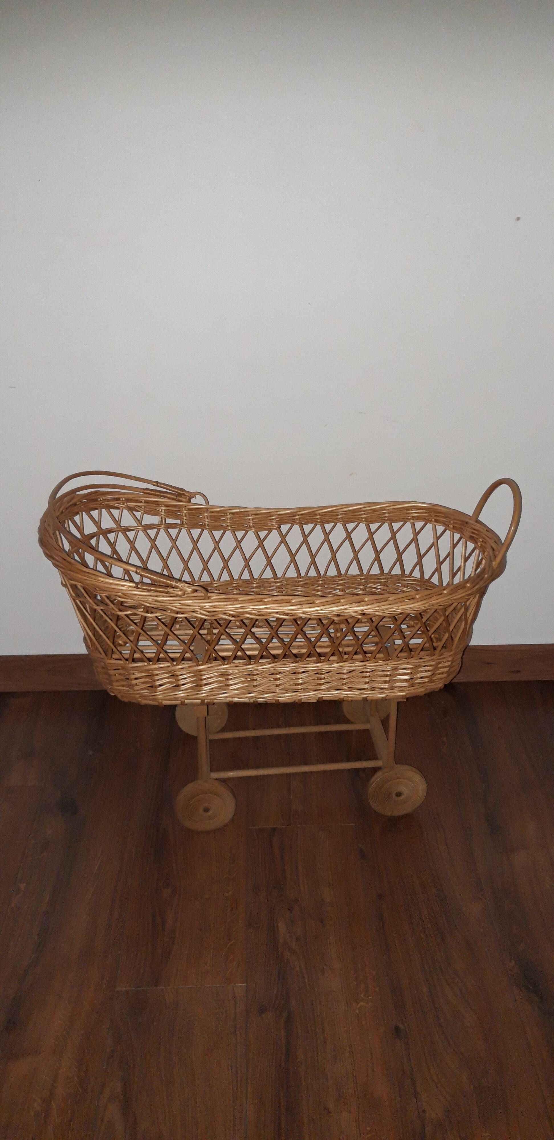 Vintage wicker cradle with wheels