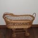 Vintage wicker cradle with wheels