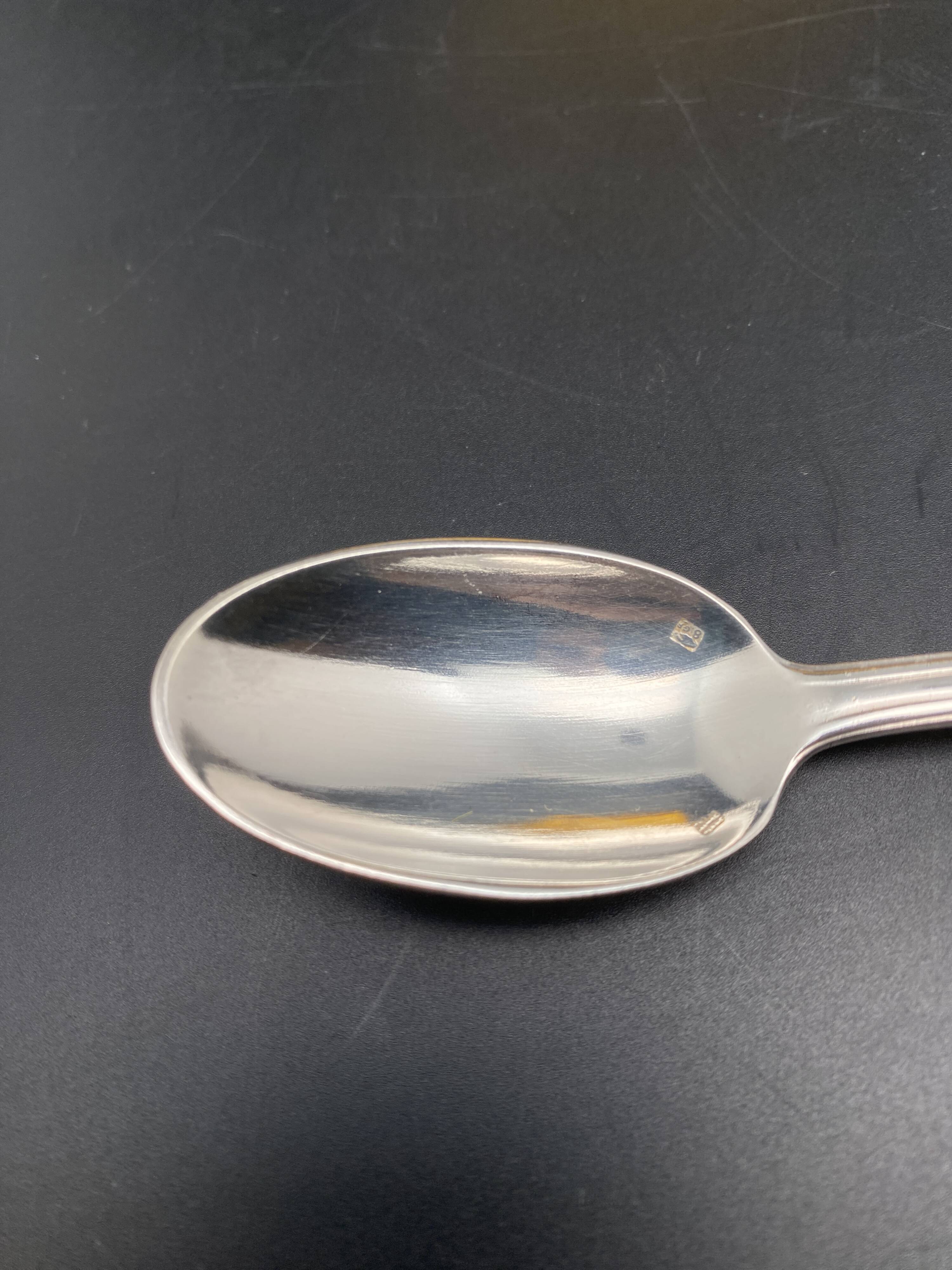 Dessert spoons in silver-white metal