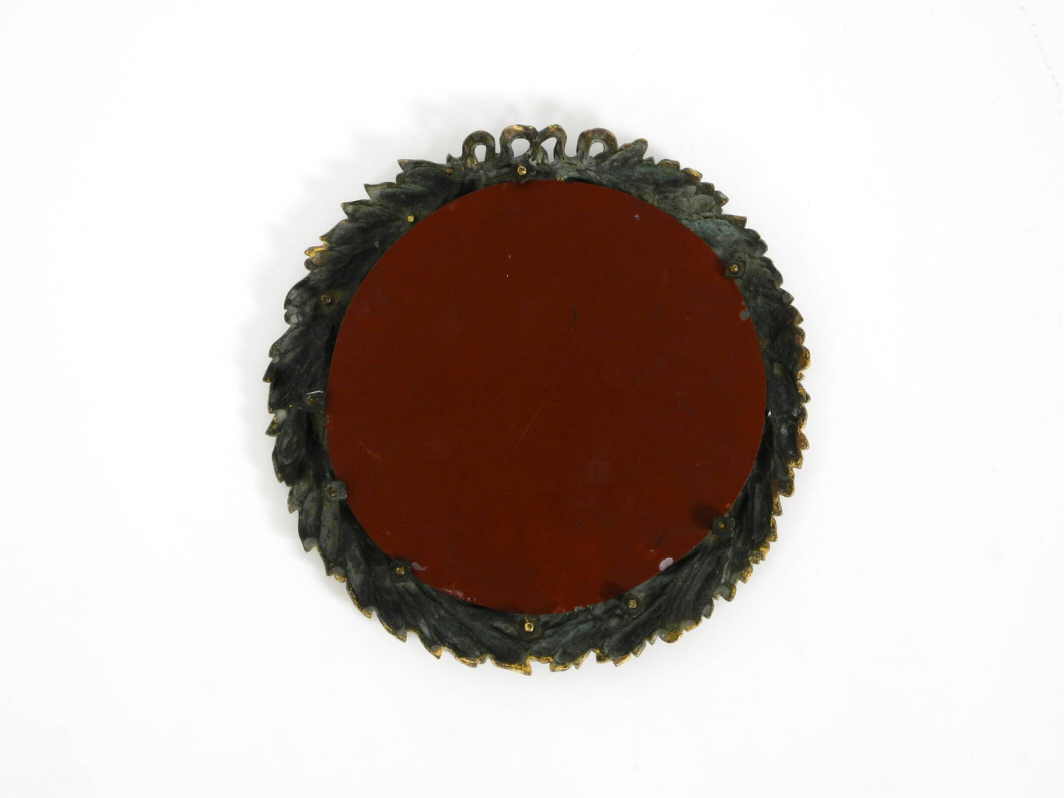 Beautiful small French mid-century wall mirror with an ornate brass frame