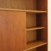 Danish teak veneered bookcase with sliding doors, 1970s