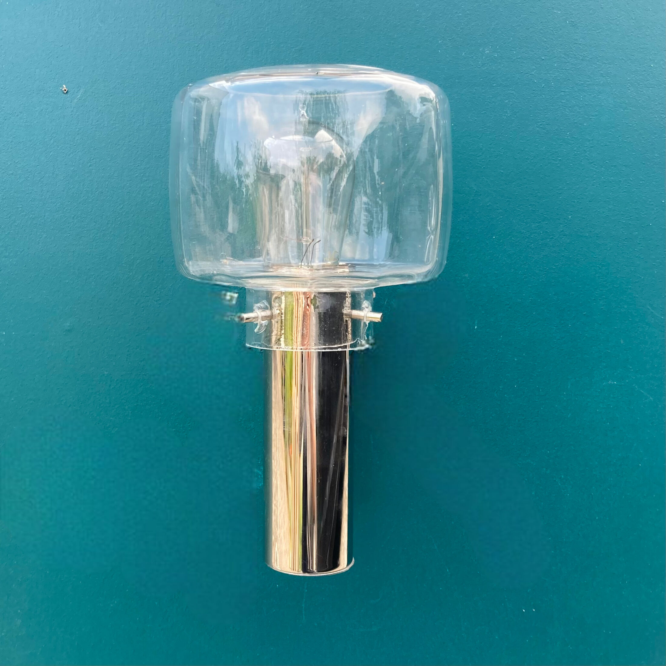 Wall lamp in stainless steel and globe in transparent glass