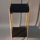 Pedestal table in patinated gilded brass faux foldable bamboo.