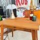 Old wooden desk or side table with compass legs