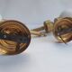 Three Empire style golden torch wall sconces