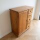 Vintage wooden storage cabinet with drawers