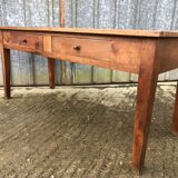 Antique solid cherry farmhouse table with 2 front drawers.