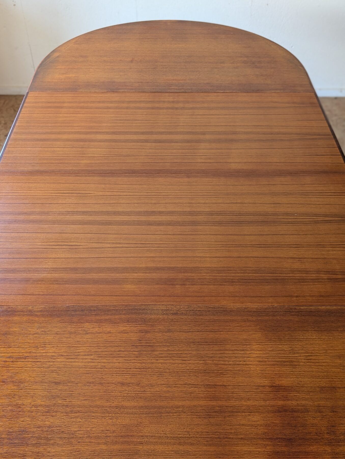 Scandinavian teak oval table from the 1960s, extendable up to 243 cm.
