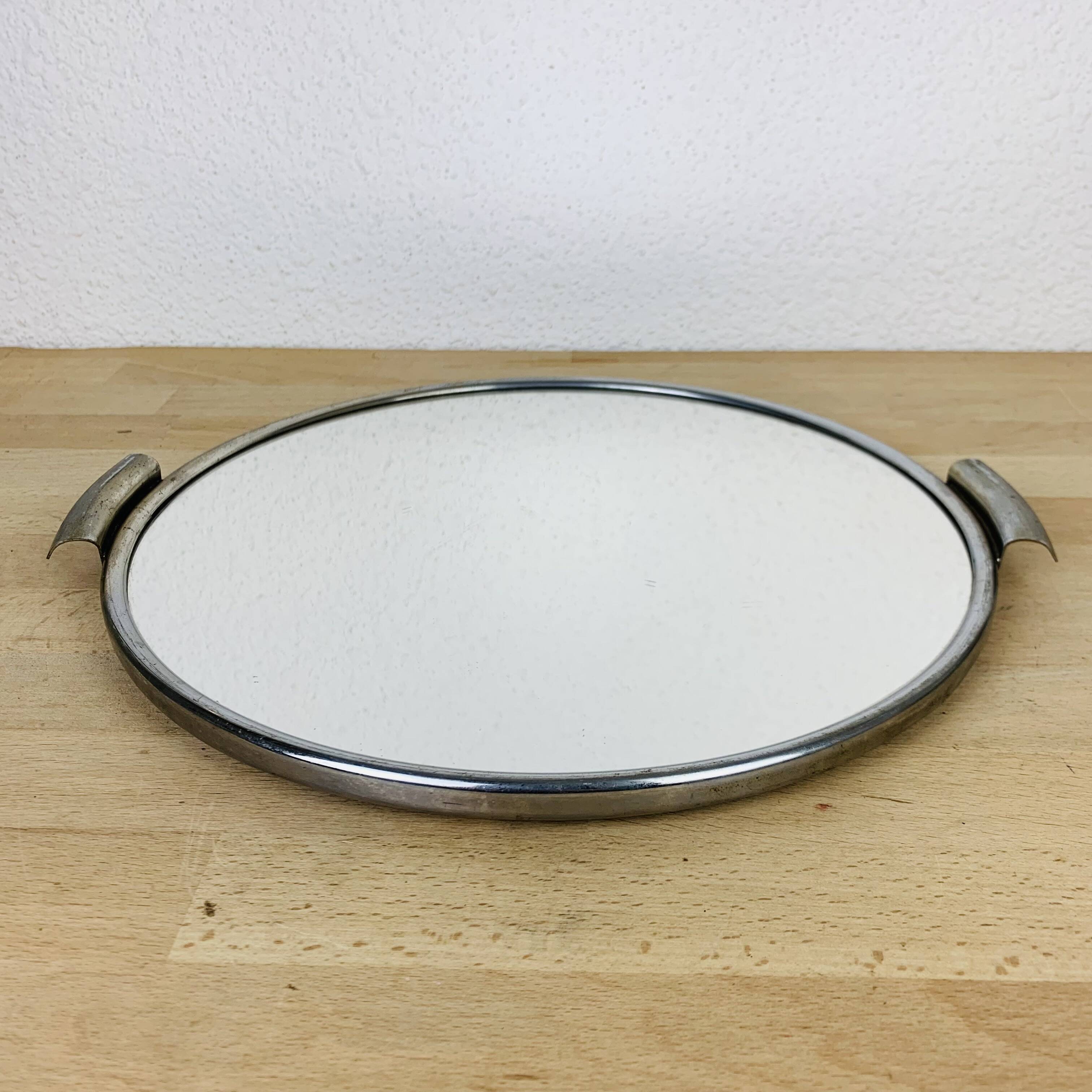 Round mirror plateau from the 1950s.