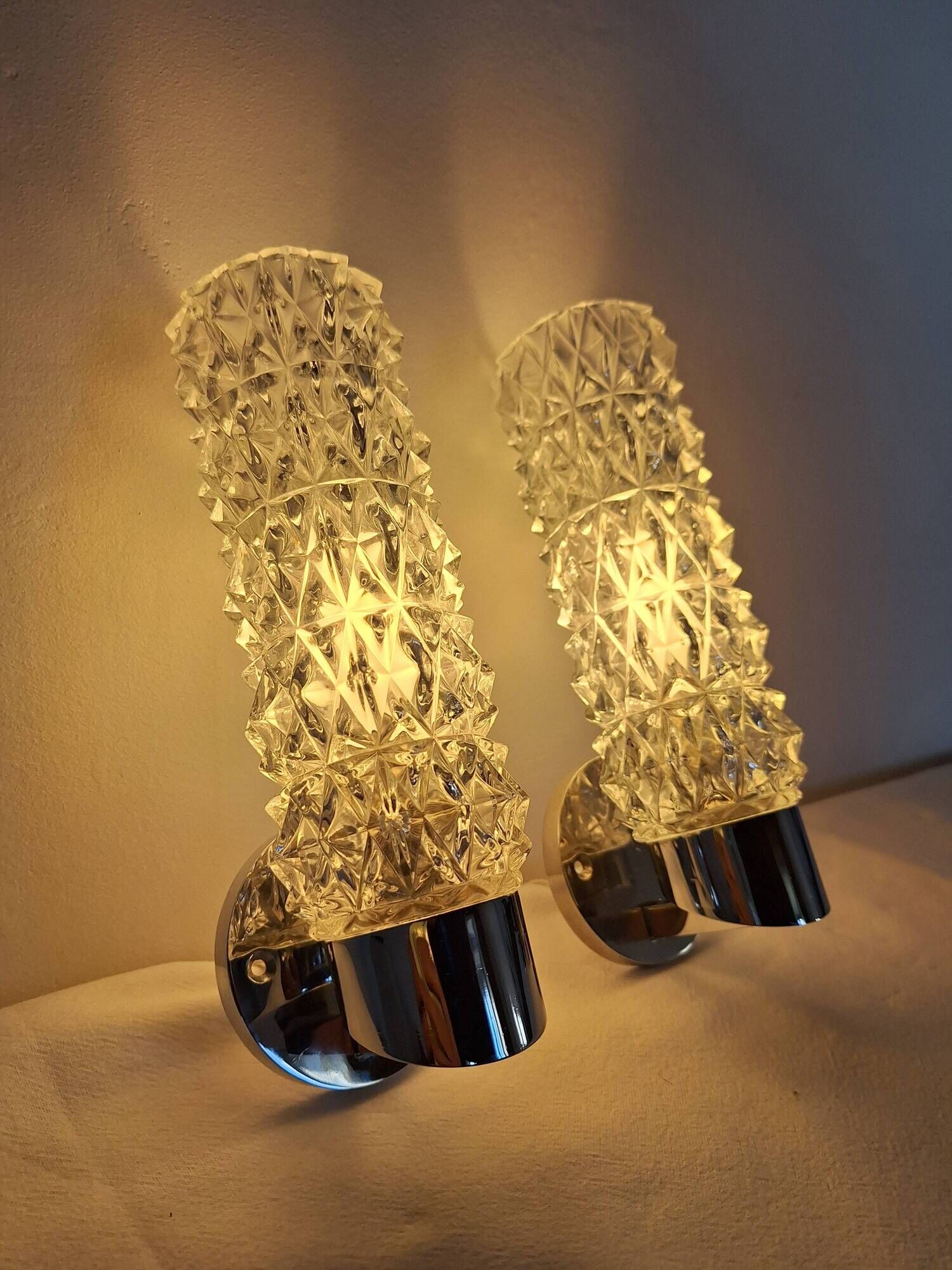 Pair of vintage Art Deco space age chrome and molded glass wall sconces