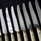 10 Vintage Bakelite, brass and stainless steel cheese knives