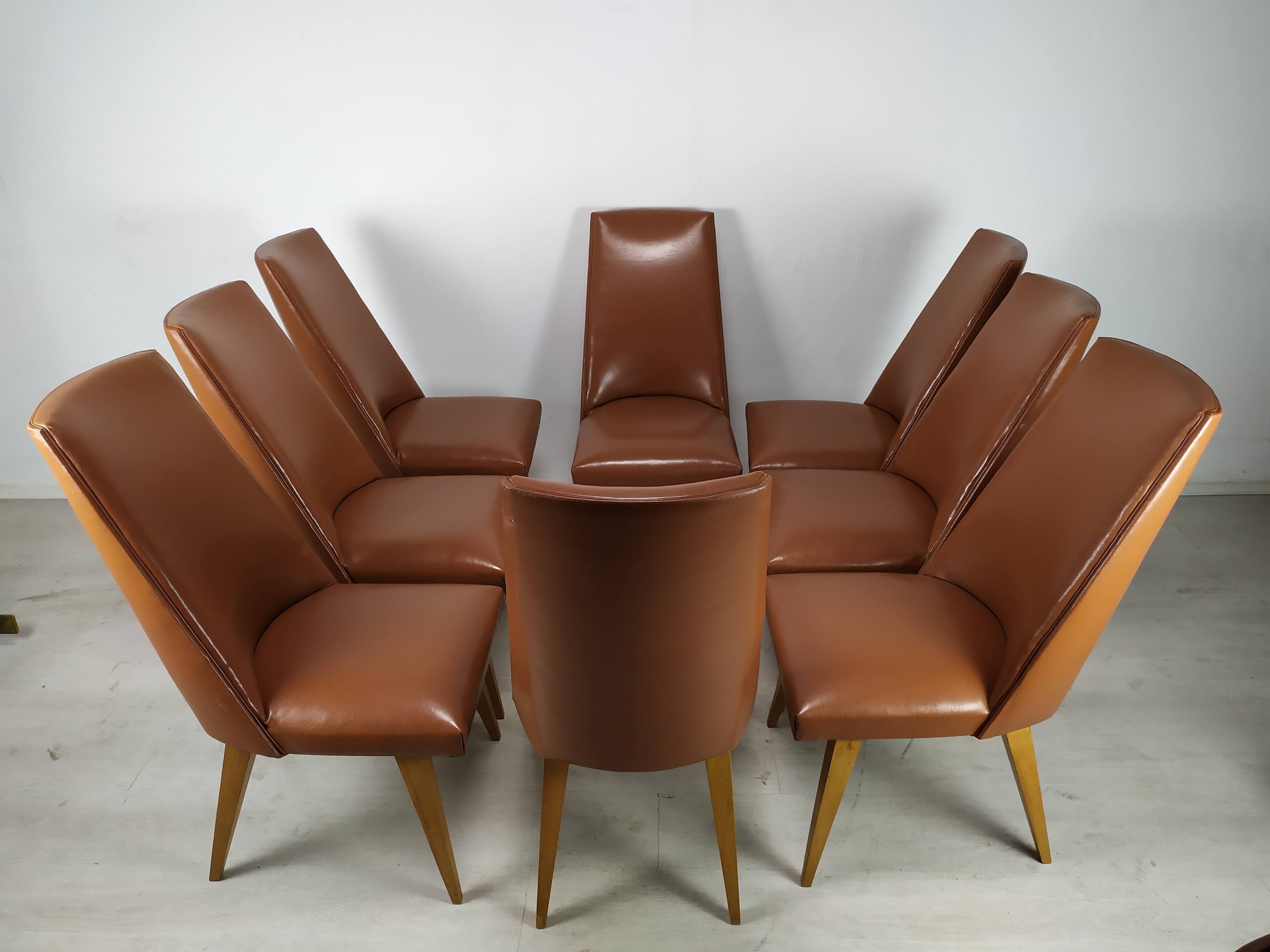 8 brown skai chairs 1950