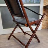 Colonial style folding leather and teak armchair