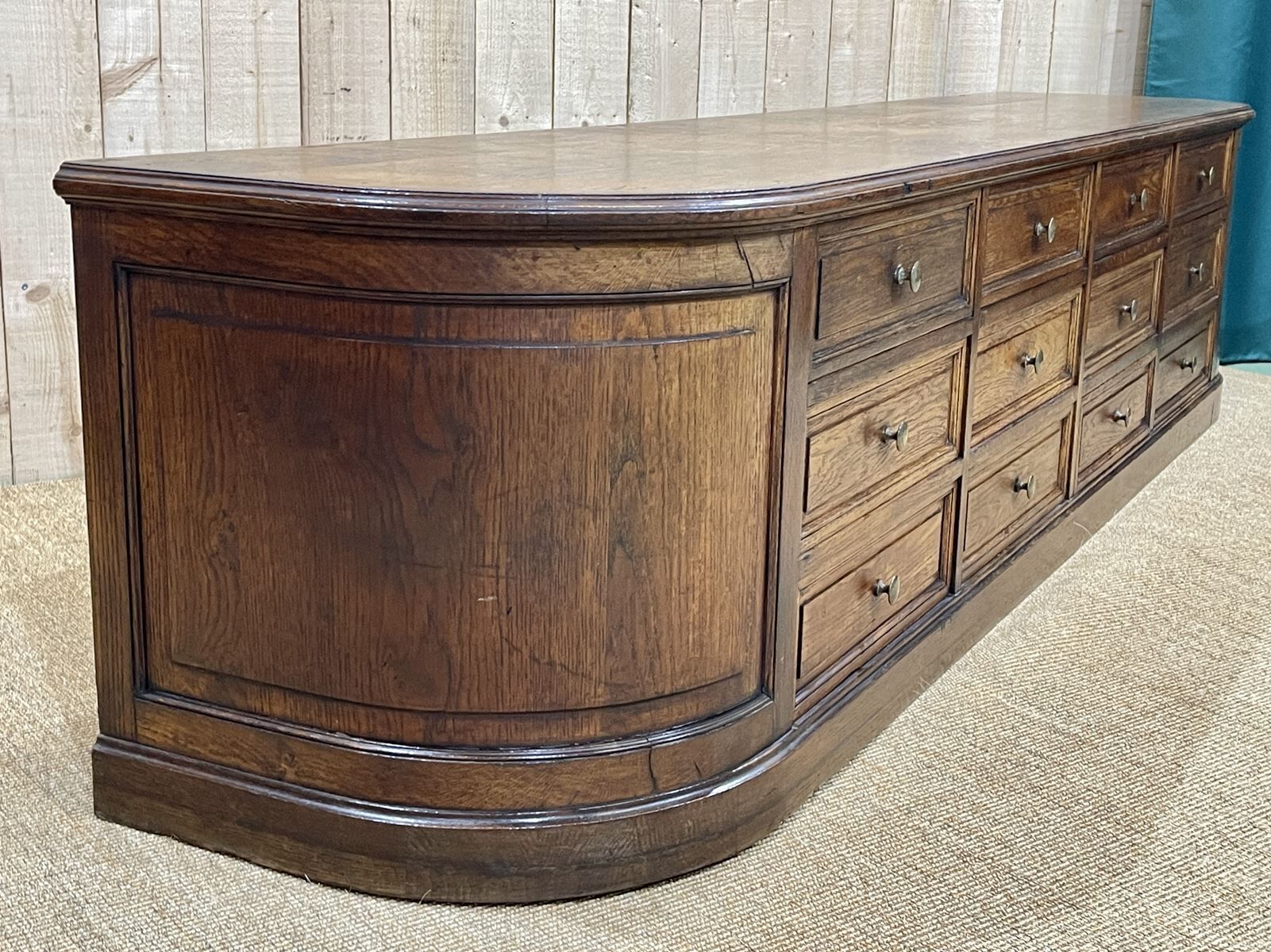 Long low oak countertop with 12 drawers - early XXth